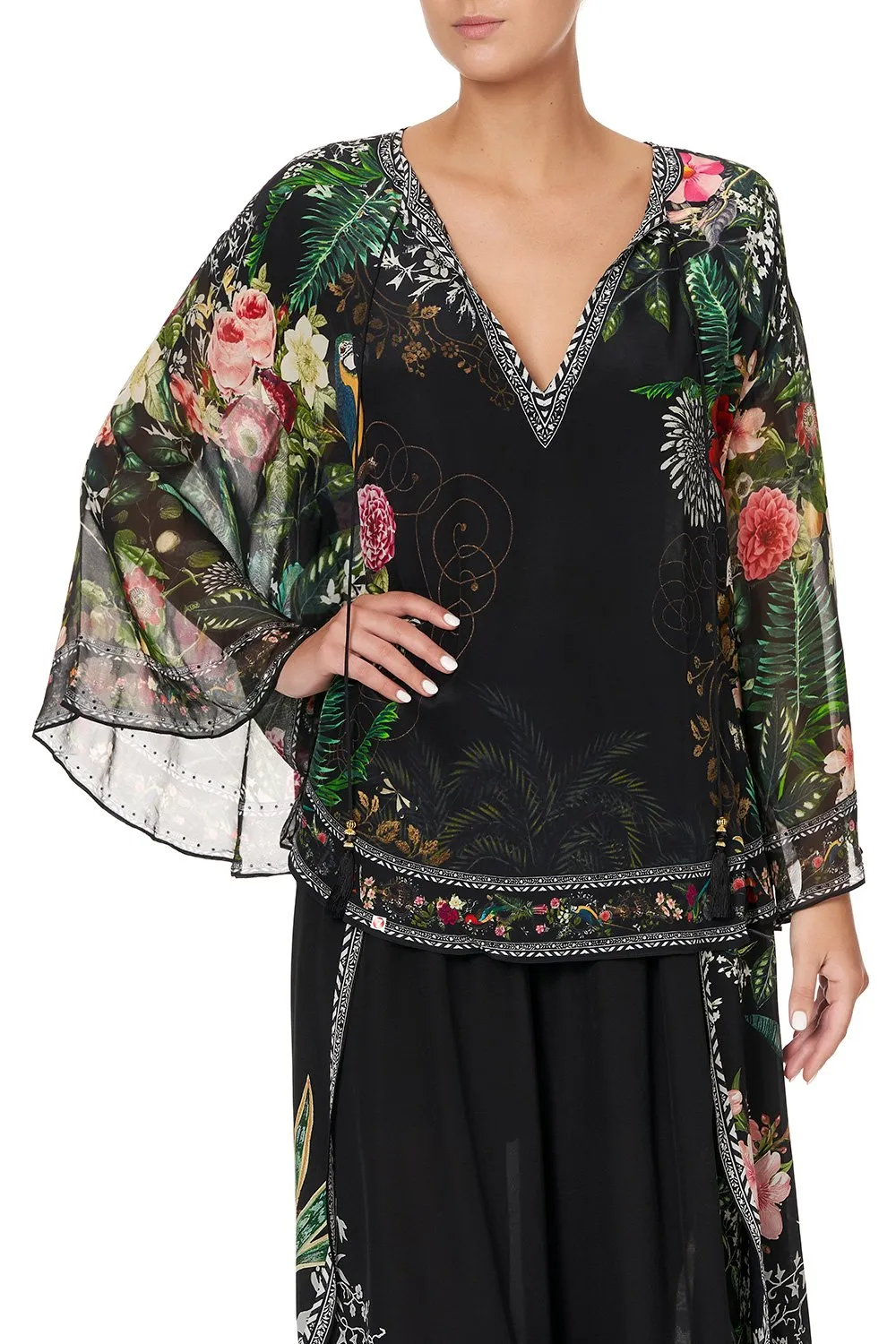 BLOUSE WITH CAPE SLEEVE RAISED WITH WOLVES